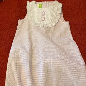 A line dress with “E” fish tail monogram